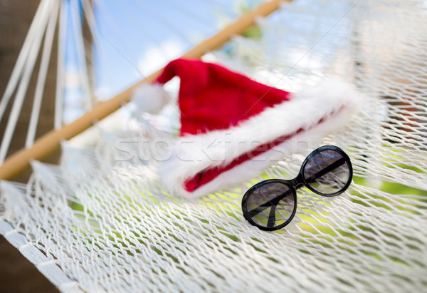 hammock with santa helper hat and shades Stock photo © dolgachov