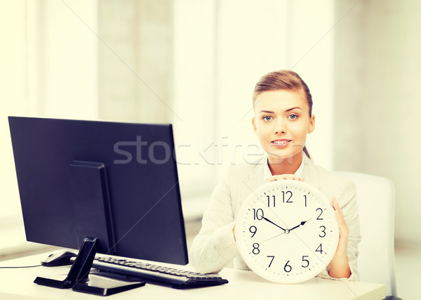 attractive businesswoman with white clock Stock photo © dolgachov