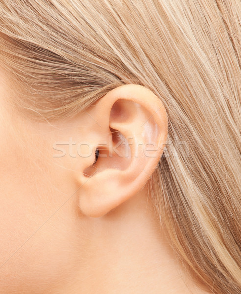 Stock photo: close up of woman's ear