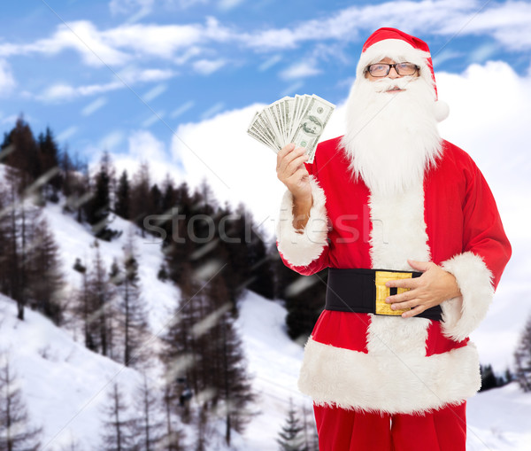Homem traje papai noel dólar dinheiro natal Foto stock © dolgachov
