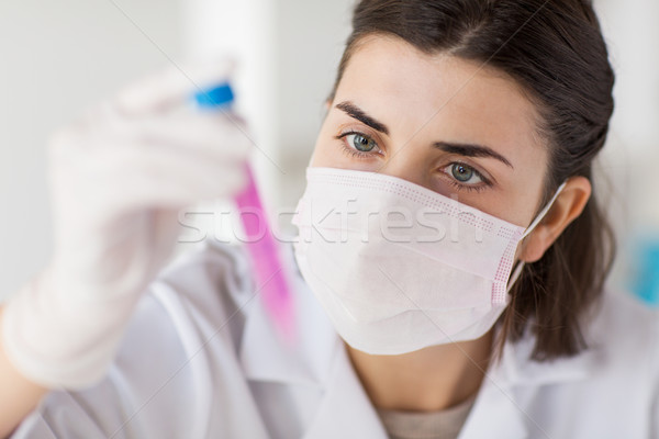 close up of scientist with tube making test in lab Stock photo © dolgachov