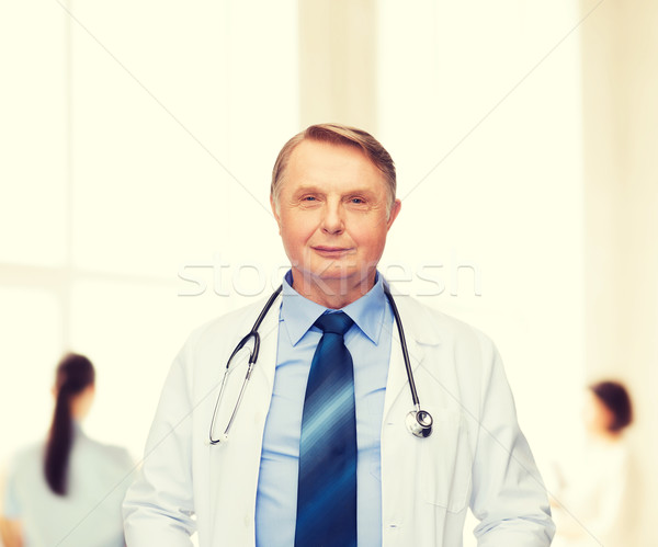 Uśmiechnięty lekarza profesor stetoskop opieki zdrowotnej muzyka Zdjęcia stock © dolgachov