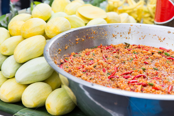 chilly wok or pilaf and mango at street market Stock photo © dolgachov