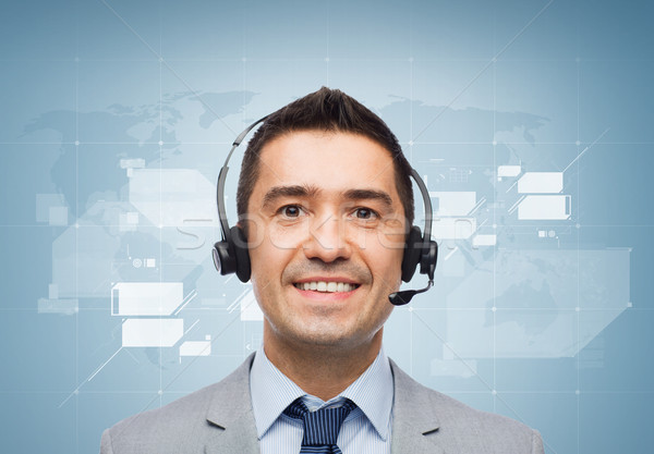 smiling businessman in headset Stock photo © dolgachov