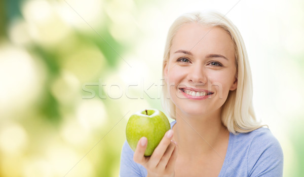 happy woman eating green apple Stock photo © dolgachov