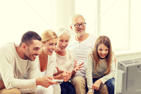 happy family watching tv at home Stock photo © dolgachov