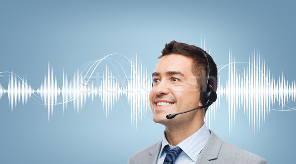 businessman in headset over sound wave or diagram Stock photo © dolgachov