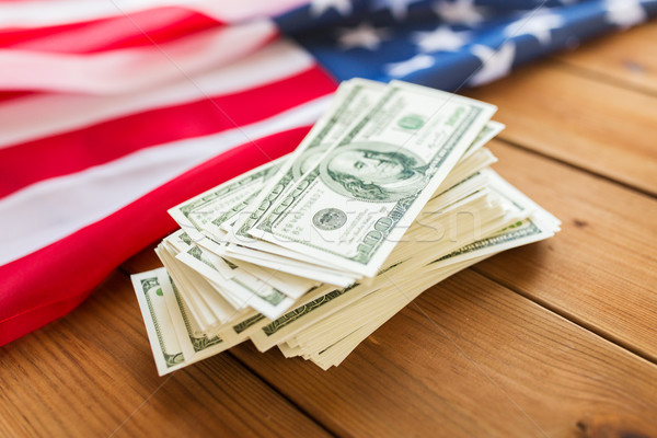 close up of american flag and dollar cash money Stock photo © dolgachov