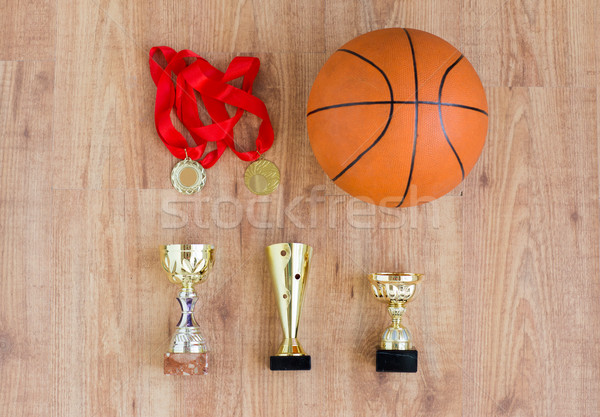 basketball ball with cups and golden medals Stock photo © dolgachov
