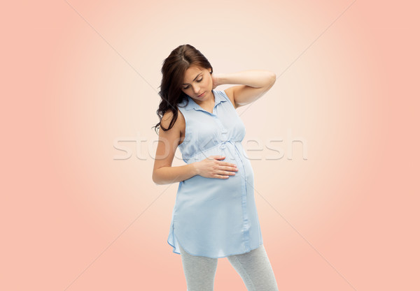 pregnant woman with neckache Stock photo © dolgachov