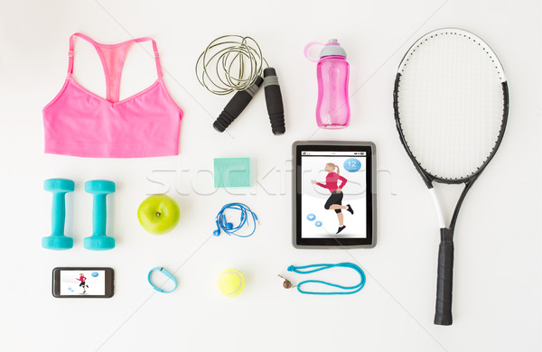 Stock photo: tablet pc, smartphone and sports stuff