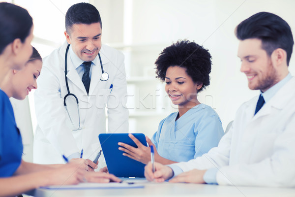 group of happy doctors meeting at hospital office Stock photo © dolgachov