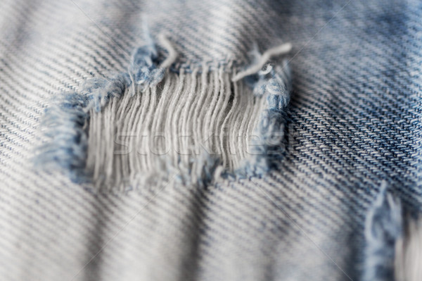 Trou minable denim jeans vêtements [[stock_photo]] © dolgachov