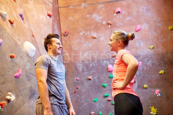man and woman talking at indoor climbing gym wall Stock photo © dolgachov