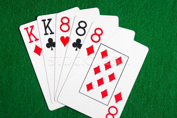 Poker mano carte da gioco verde casino panno Foto d'archivio © dolgachov