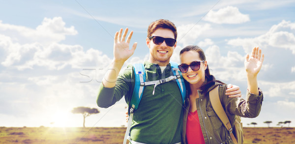 smiling couple with backpacks traveling in africa Stock photo © dolgachov