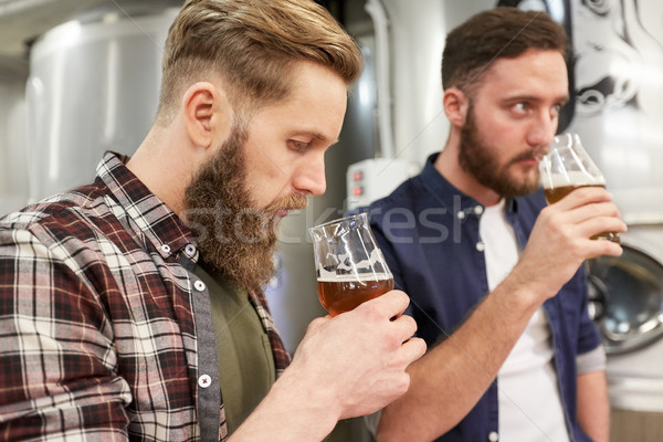 Stock photo: men testing non-alcoholic craft beer at brewery