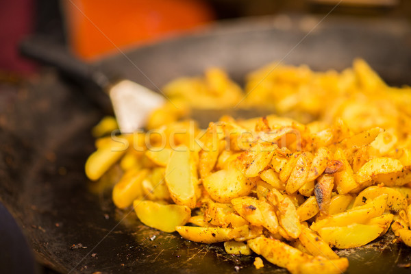 fried potato on stir fry pan Stock photo © dolgachov