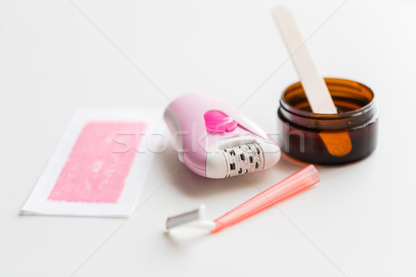 safety razor, epilator, hair removal wax and patch Stock photo © dolgachov