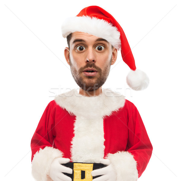 surprised man in santa claus costume over white Stock photo © dolgachov