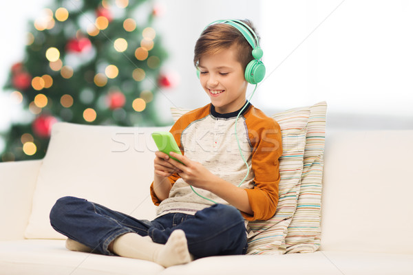 мальчика смартфон наушники Рождества детей технологий Сток-фото © dolgachov