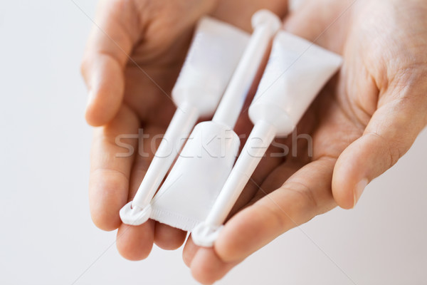 hand holding tubes of micro enema Stock photo © dolgachov