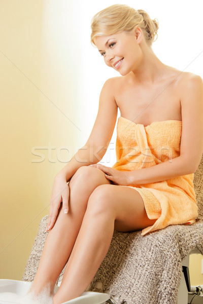 woman in spa salon having pedicure Stock photo © dolgachov