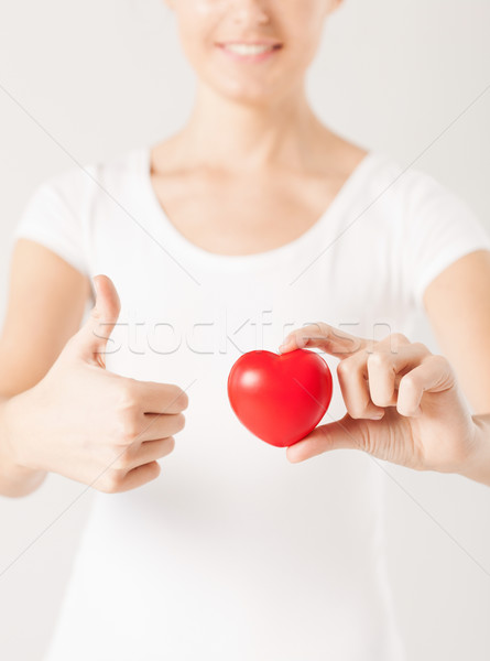 Donna mani cuore Foto d'archivio © dolgachov