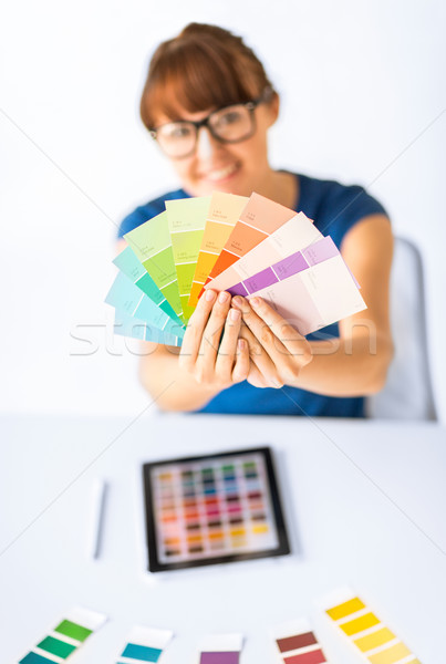 woman showing pantone color samples Stock photo © dolgachov