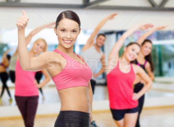 Stock photo: personal trainer with group in gym