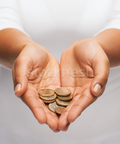 womans cupped hands showing euro coins Stock photo © dolgachov