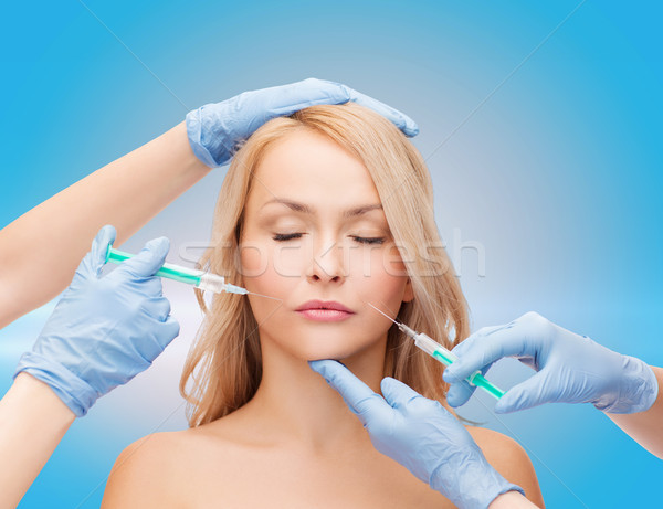 Vrouw gezicht handen schoonheid cosmetische chirurgie vrouw Stockfoto © dolgachov