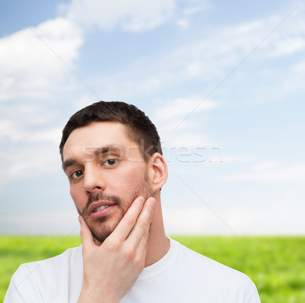 Schönen Mann anfassen Gesicht Gesundheit Stock foto © dolgachov