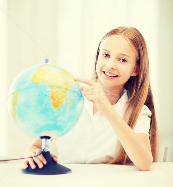 student girl with globe at school Stock photo © dolgachov