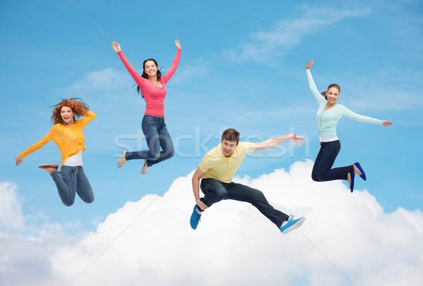 Foto stock: Grupo · sorridente · adolescentes · saltando · ar · felicidade