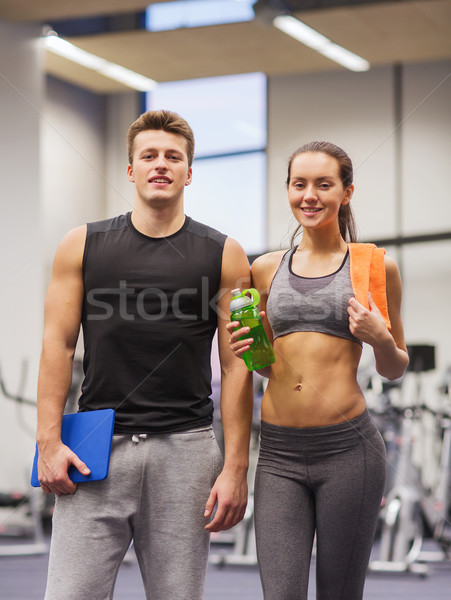 Heureux couple gymnase eau fitness [[stock_photo]] © dolgachov