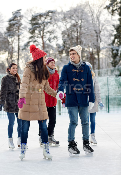 Boldog barátok korcsolyázás pálya kint emberek Stock fotó © dolgachov