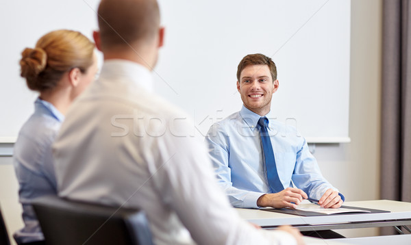Gruppo sorridere riunione ufficio uomini d'affari Foto d'archivio © dolgachov
