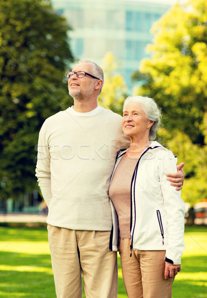 senior couple hugging in city park Stock photo © dolgachov