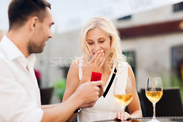 happy couple with engagement ring and wine at cafe Stock photo © dolgachov