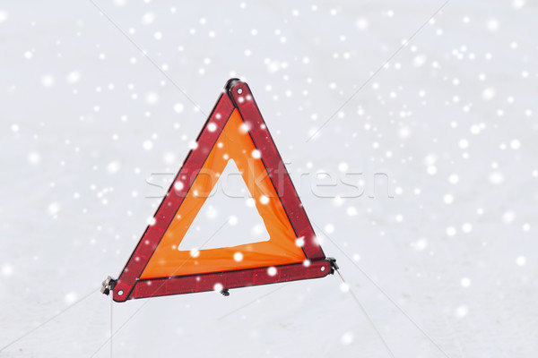closeup of warning triangle on snow Stock photo © dolgachov
