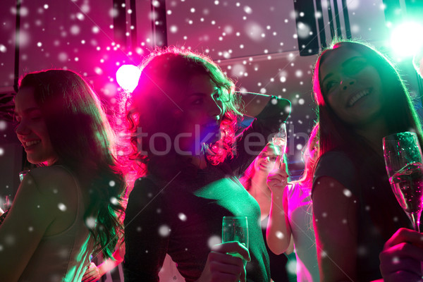 Gülen arkadaşlar gözlük şampanya kulüp parti Stok fotoğraf © dolgachov