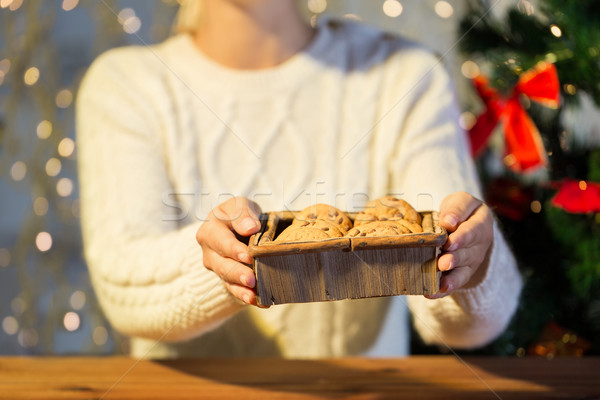 close up of woman with oat cookies at home Stock photo © dolgachov