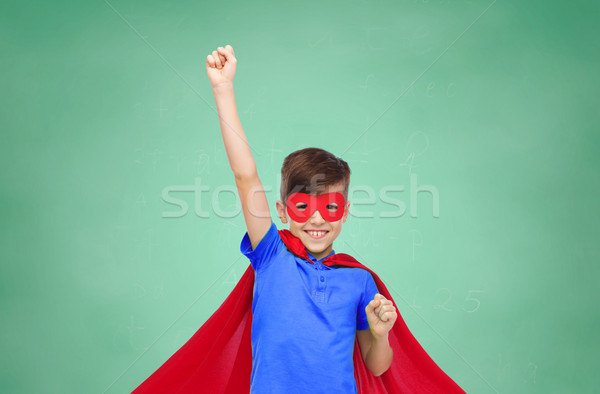 boy in red superhero cape and mask showing fists Stock photo © dolgachov