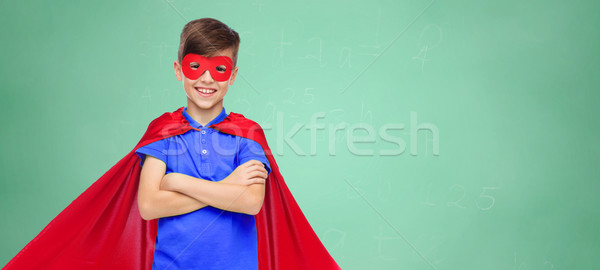 boy in red super hero cape and mask Stock photo © dolgachov