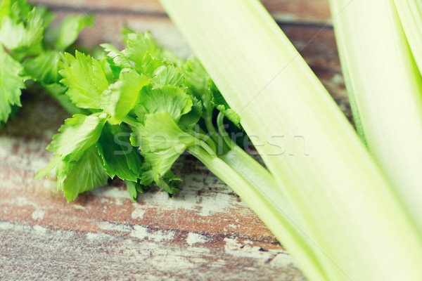 close up of celery stems on wooden table Stock photo © dolgachov