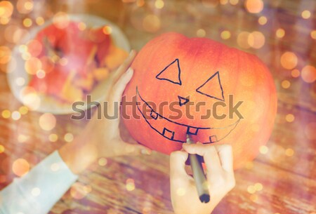 close up of carved halloween pumpkins on table Stock photo © dolgachov