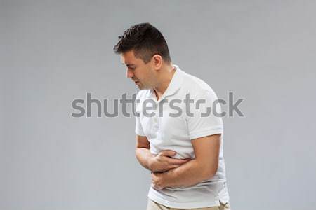 Infeliz hombre sufrimiento dolor de estómago personas salud Foto stock © dolgachov