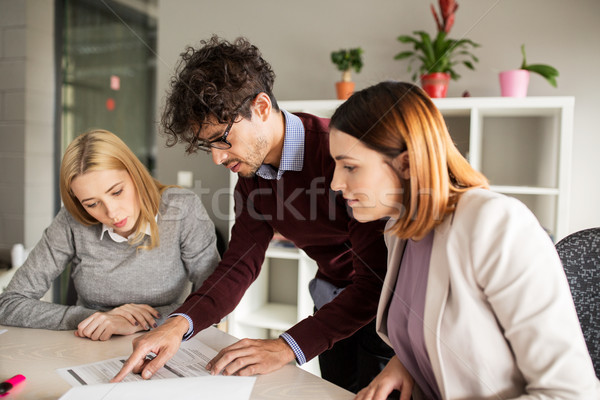 Stock photo: happy business team with papers in office