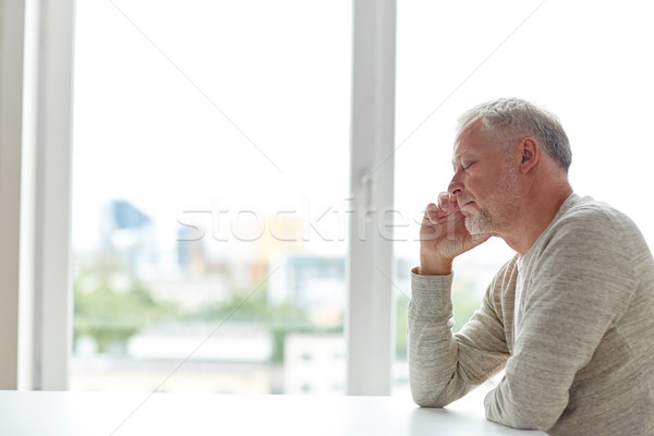 Stock photo: close up of senior man thinking
